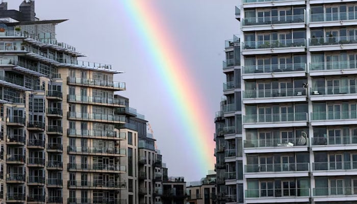 A rainbow is seen over apartments in Wandsworth on the River Thames as UK house prices continue to fall, in London, Britain, August 26, 2023. — Reuters