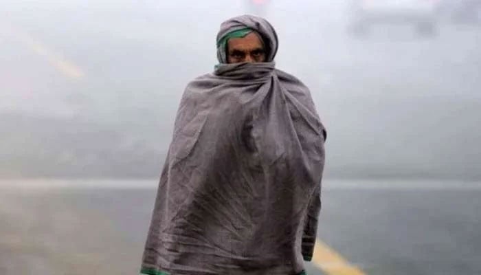 A representational image shows a man wearing a shawl on a cold day. — Reuters/File