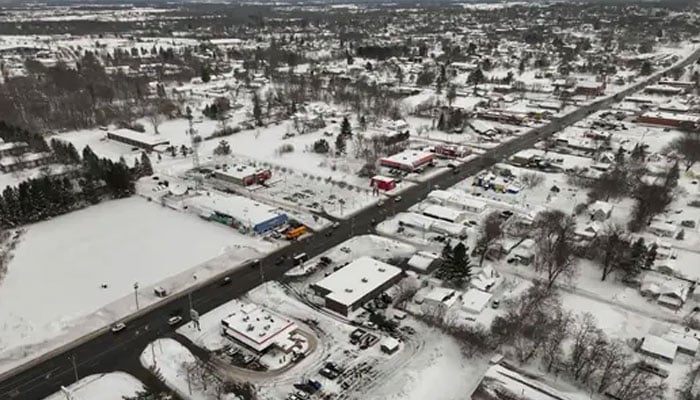 In this aerial view, morning snow covers the town of December 4, 2024 in Watertown, New York. —AFP