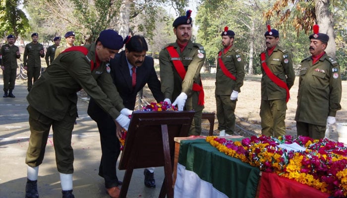 Police officials seen paying tribute to a martry in this undated image.— Pubjab Police website/File