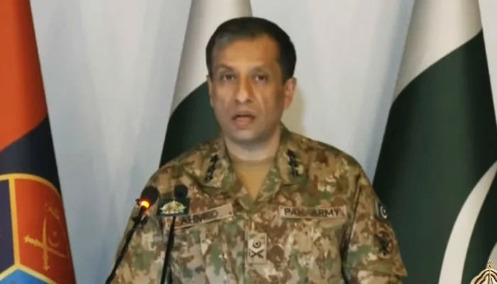 DG ISPR Lt Gen Ahmad Sharif Chaudhry is briefing the media at the GHQ in Rawalpindi on August 5, 2024. — Screengrab/YouTube/GeoNews