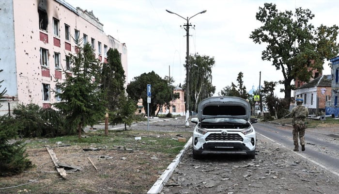 A Ukranian soldier walks down a street in Sudzha, a Russian village controlled by Ukraine, in the Kursk region, August 16, 2024. —AFP