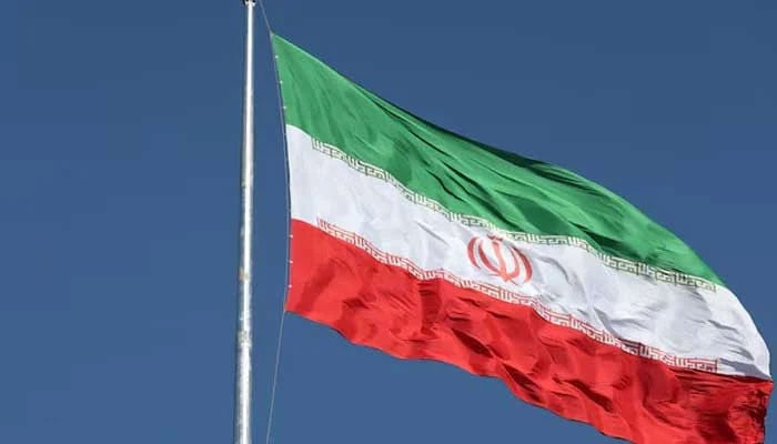 The Iranian flag is seen flying over a street in Tehran, Iran, February 3, 2023. — Reuters