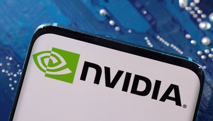 A smartphone with a displayed NVIDIA logo is placed on a computer motherboard in this illustration taken on March 6, 2023. — Reuters