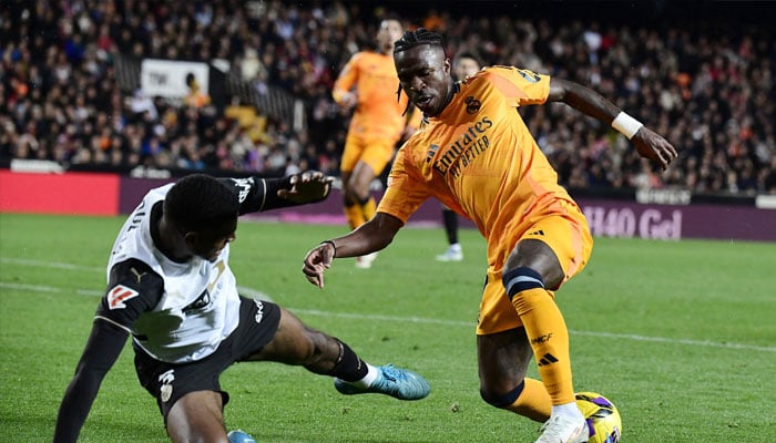 Real Madrids Brazilian forward Vinicius Junior (right) in action against Valencia. — AFP/File