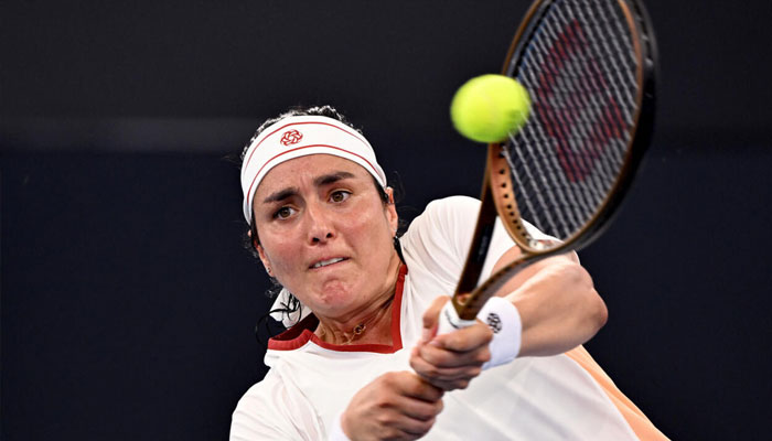 Ons Jabeur of Tunisia hits a return in the Brisbane quarter-finals. —AFP/File