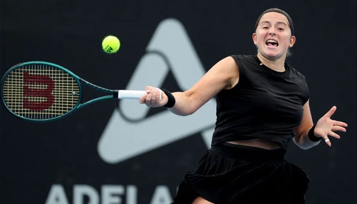 Latvias Jelena Ostapenko hits a return against Polands Magdalena Frech during their womens singles match at the Adelaide International tennis tournament in Adelaide. —AFP/File