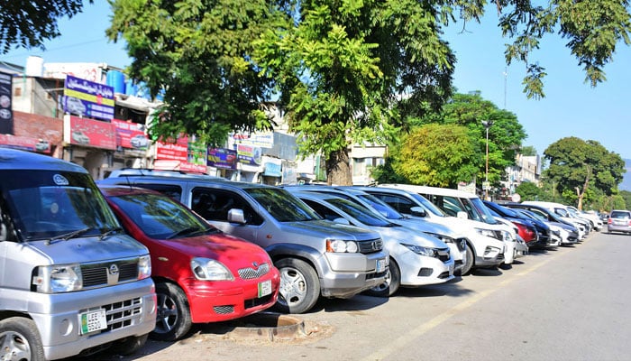 A view of cars parked by the roadside. — Online/File