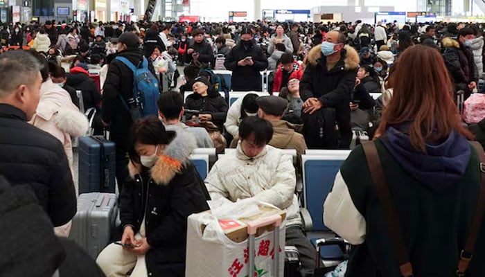 Travellers wait for their trains at Shanghai Hongqiao railway station, during the Spring Festival travel rush ahead of the Chinese Lunar New Year, in Shanghai, China February 7, 2024. — Reuters