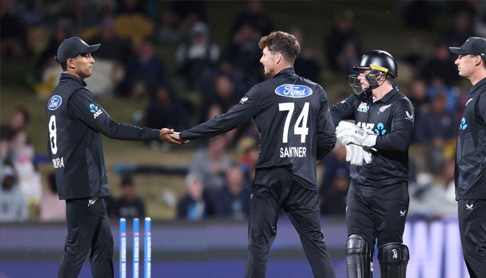 New Zealands Mitchell Santner (centre) celebrates the wicket of Sri Lankas Wanindu Hasaranga during the second one-day international cricket match between New Zealand and Sri Lanka at Seddon Park in Hamilton on January 8, 2025.— AFP