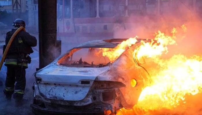 A firefighter extinguishes cars which burn after Russian air and missile strikes, amid Russias attack on Ukraine, in Zaporizhzhia, Ukraine January 8, 2025. — Reuters