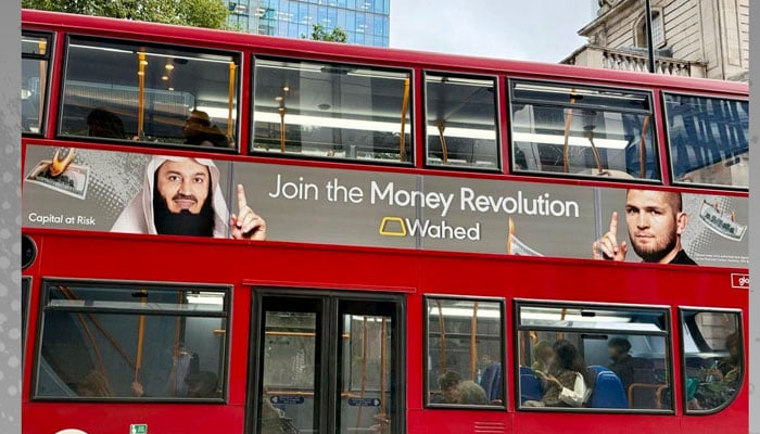 An advertisement panaflex on bus in UK can be seen. — Facebook@WahedInvest/File