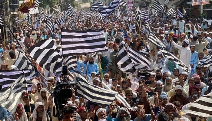 JUI supporters hold flags during a party rally in this image released on October 26, 2203. — Facebook@Jamiat Ulama-e-Islam Pakistan