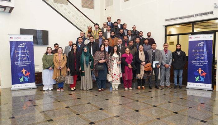 The image is a group photo after a seminar on Fostering Societal Cohesion, Tolerance, and Peacebuilding organised by National Academy of Higher Education (NAHE), in collaboration with Pakistan Institute of Legislative Development and Transparency (PILDAT) and the Centre for Peace and Development Initiatives (CPDI) on January 8, 2025. — Facebook@HECPakistan2002