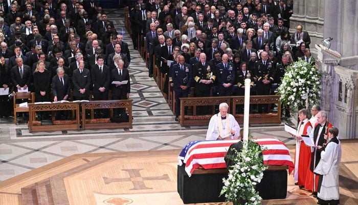 Members of the clergy pray over the casket of former US president Jimmy Carter during his state funeral at Washington National Cathedral, as all five living US presidents look on, January 9, 2025. —AFP