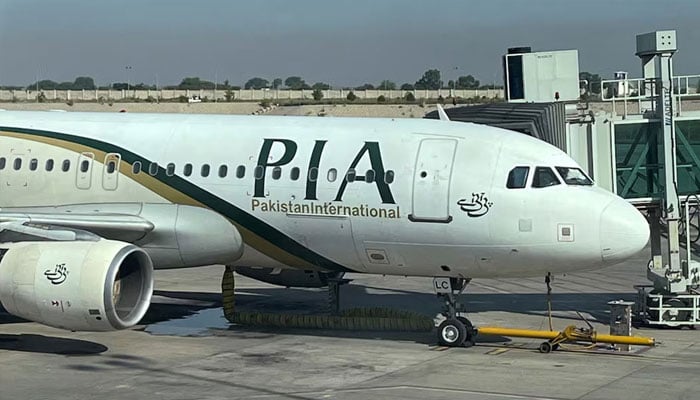 View of the Pakistan International Airlines (PIA) passenger plane, taken through a glass panel, at Islamabad International Airport, Pakistan October on 3, 2023. — Reuters