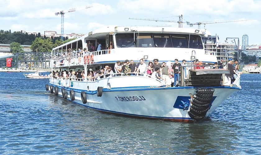 A ferry sailing across Bosphorus and Golden Horn