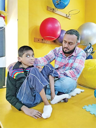 Bilal receiving physiotherapy at Dar-ul-Sukoon