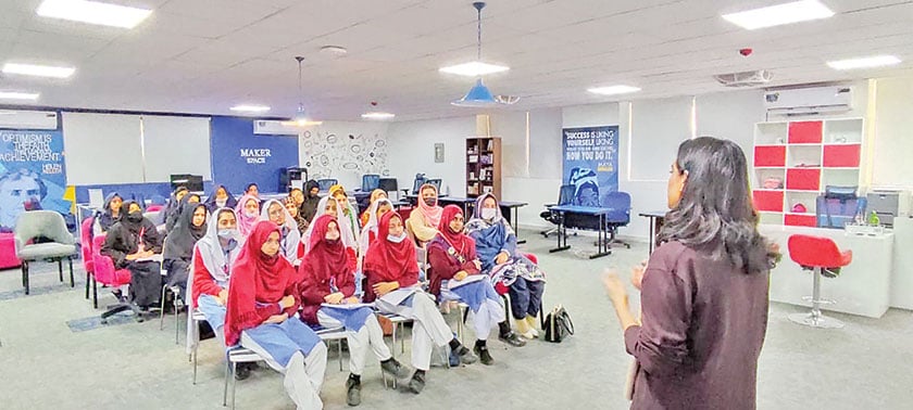 Zunaira conducting in-person session with school girls