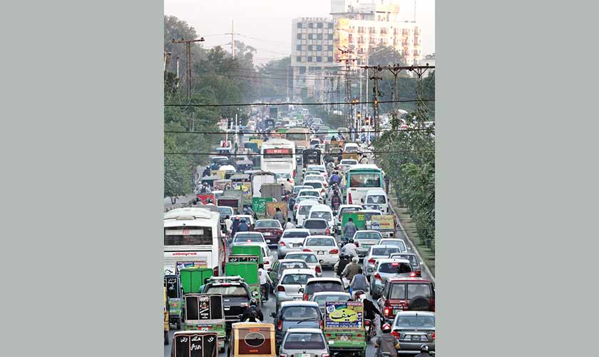 Traffic jams in most parts of the city are a daily occurrence. — Photo by Rahat Dar