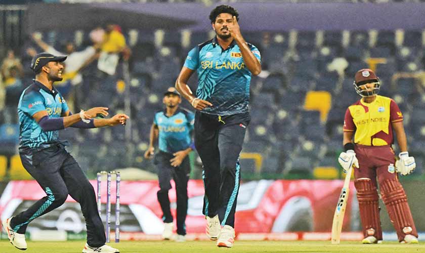 Sri Lanka’s Binura  Fernando (C) celebrates after taking the wicket of West Indies’ Evin Lewis