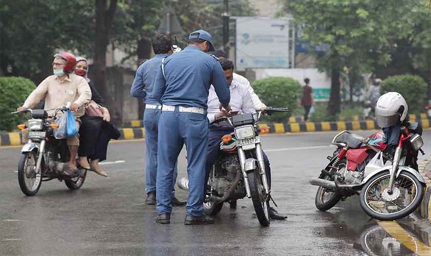 “The task is laborious given the number of the registered two-wheelers in Lahore.” — Photos by Rahat Dar