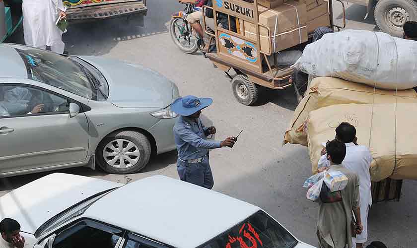 Issuing challans manually is a burden on the traffic wardens that affects their overall performance. — Photo by Rahat Dar