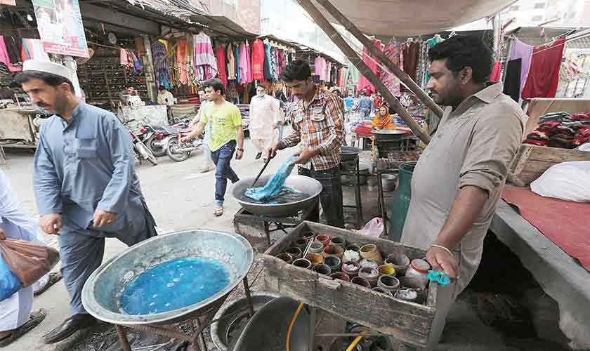 The pavements and roads in the busiest of bazaars are said to be ‘auctioned’ by the encroachment mafia in connivance with the authorities that are allegedly hand in glove with the traders’ unions. Millions of rupees are believed to change hands in the process. — Photo by Rahat Dar