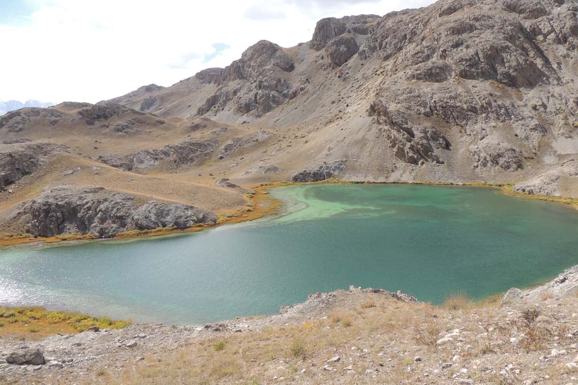 A small lake lodged neatly between hills.