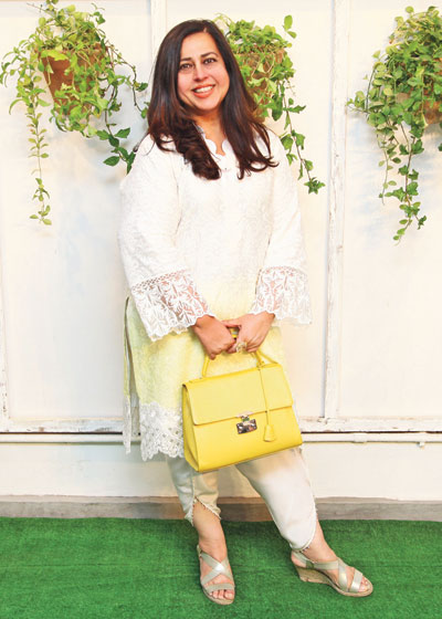 Ayesha Tammy Haq  Dressed in white and sundown yellow 