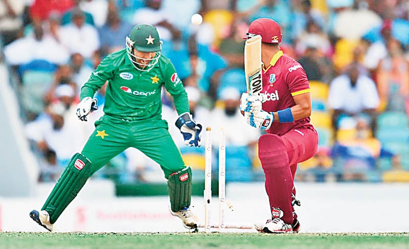 Bamboozled: West Indies’ Lendl Simmons drags one back onto the stumps off Shadab Khan in the first T20 International on March 26, 2017