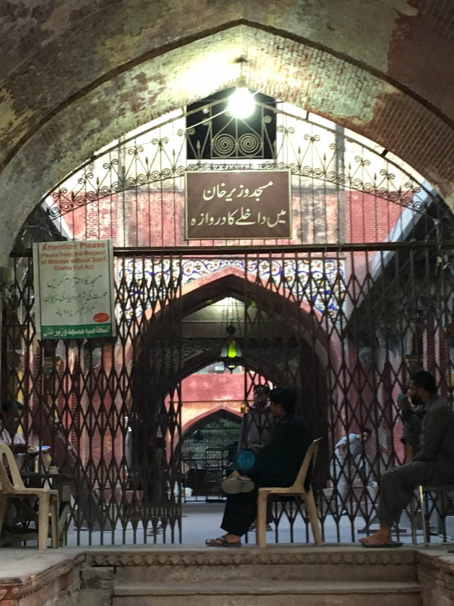 Signboard spells it out: Entrance to the Wazir Khan Mosque. 