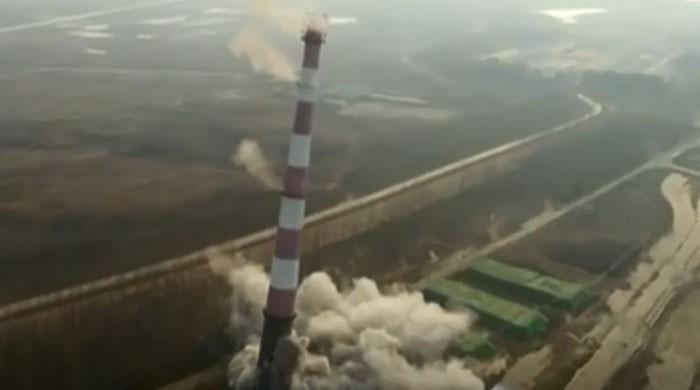 Chinese engineers brought down a 57-year-old tower