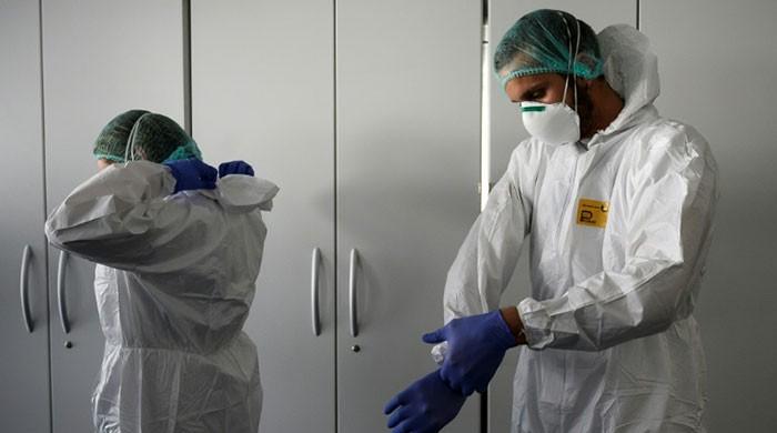 Record virus deaths in Spain as world hunkers down