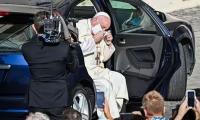 In a first, Pope Francis wears face mask in public