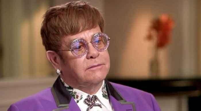 Sir Elton John reveals he was afraid his wig would fly off during a concert in Australia