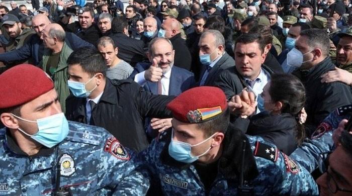 Armenian PM accuses military of coup, brings thousands of protesters out to the streets