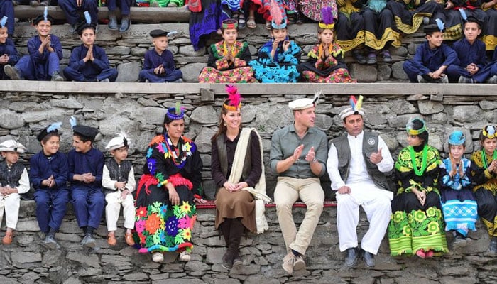 Prince William and Kate Middleton engage with the local public and enjoy festivities while donning traditional clothes