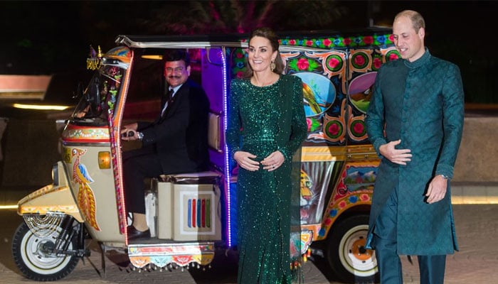 Prince William and Kate Middleton arrive at an event in Islamabad in an auto-rickshaw