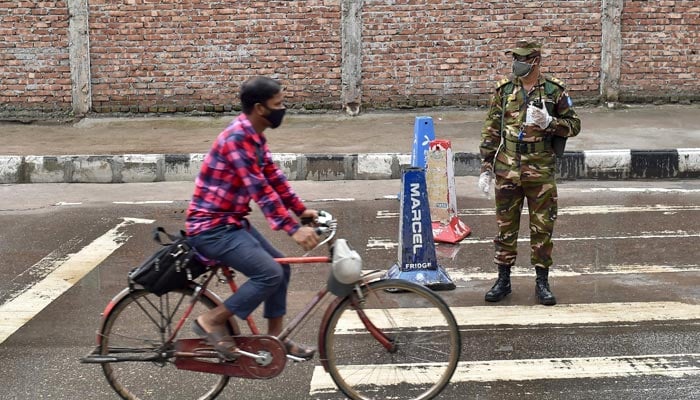 A Bangladesh army personnel stands along a road in Dhaka on July 1, 2021, during a strict Covid-19 Coronavirus lockdown, with the army and police ordered to stop people leaving their homes except for emergencies or to buy essentials. — AFP/File