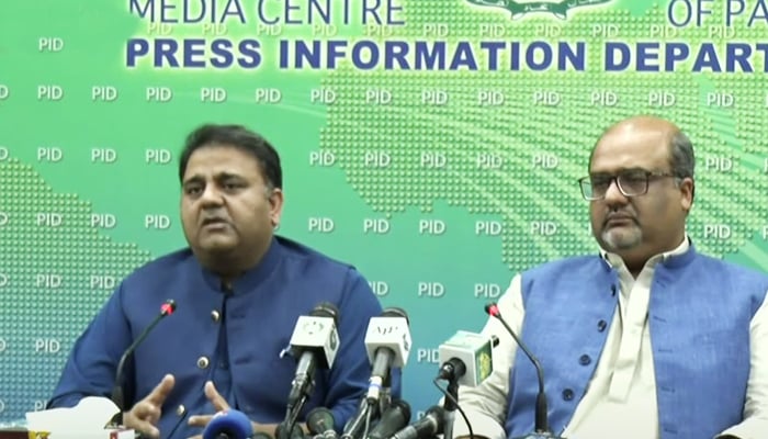 Minister for Information and Broadcasting Fawad Chaudhry (left) along with Adviser to Prime Minister on Interior and Accountability Shahzad Akbar addressing a press conference at Press Information Department in Islamabad, on July 24, 2021. — YouTube/HumNewsLive