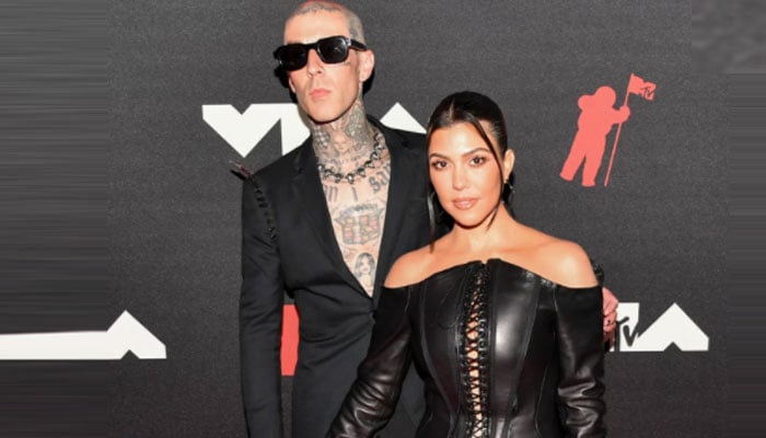 Kourtney Kardashian and Travis Barker mock Scott Dipstick with a kiss