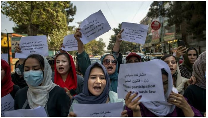 About a dozen Afghan women protested briefly Sunday outside the old Ministry for Womens Affairs, which has now been replaced by a department that earned notoriety for enforcing strict islamic doctrine — AFP