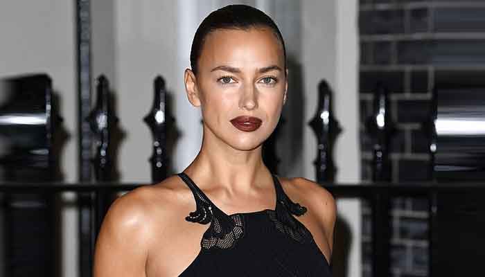 Irina Shayk cuts a stylish figure in floor-length black outfit