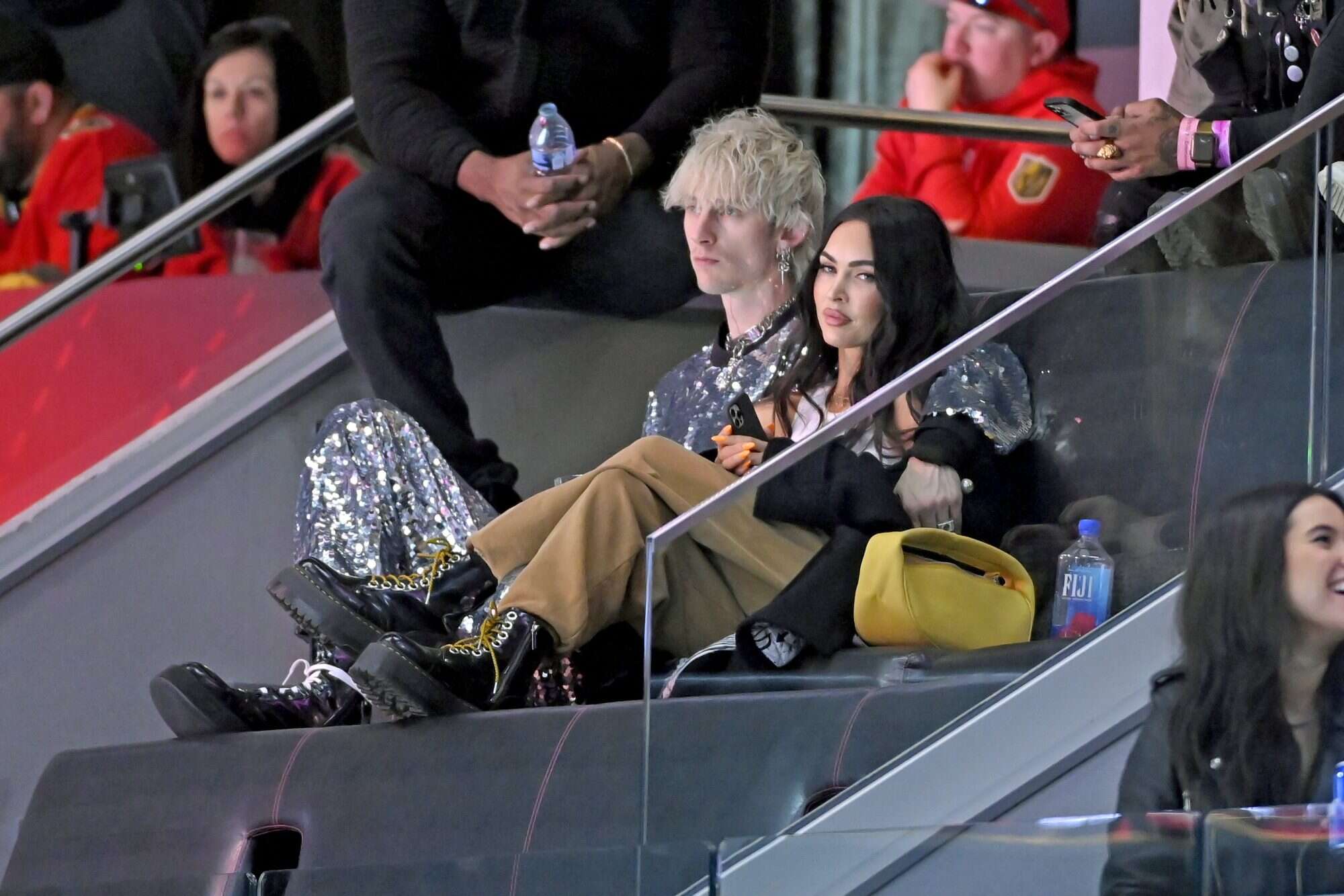 Machine Gun Kelly gets cozy with fiancée Megan Fox at NHL All-Star Game 2022