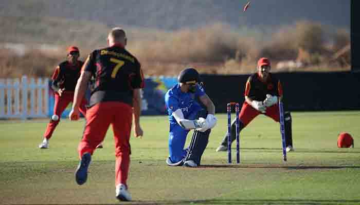 German players in action versus Italy. -Courtesy ICC