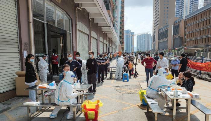 Chinese cities and factories lock down as COVID outbreak spreads