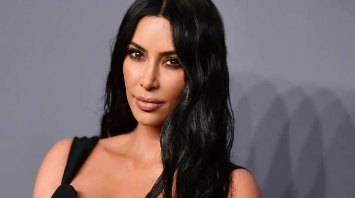 Kim Kardashian flaunts new $50K custom diamond name chain, sets ...