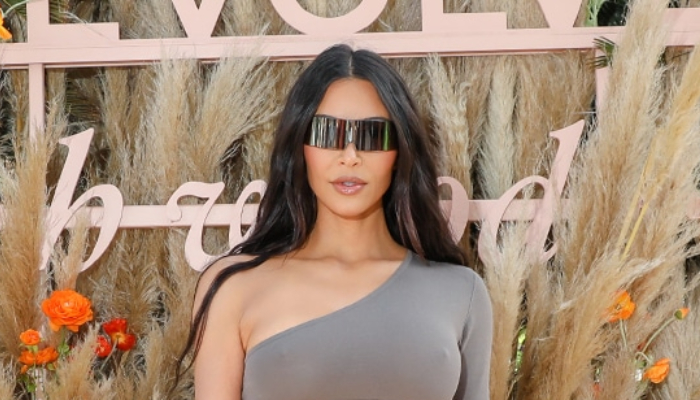 Kim Kardashian has been accused of kicking out around 300 people from a spot at the Revolve Festival