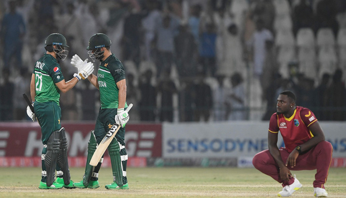 Pakistans Khushdil Shah (2ndL) celebrates his victory with teammate Mohammad Nawaz (L) as West Indiess Jayden Seales reacts during the first one-day international (ODI) cricket match between Pakistan and West Indies at the Multan Cricket Stadium in Multan on June 8, 2022. -AFP